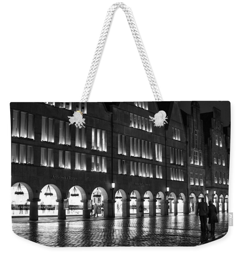  Weekender Tote Bag featuring the photograph Cobblestone Night Walk in the Town by Miguel Winterpacht