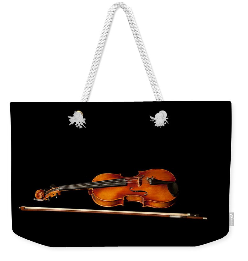 Violin Weekender Tote Bag featuring the photograph My old fiddle and bow by Torbjorn Swenelius