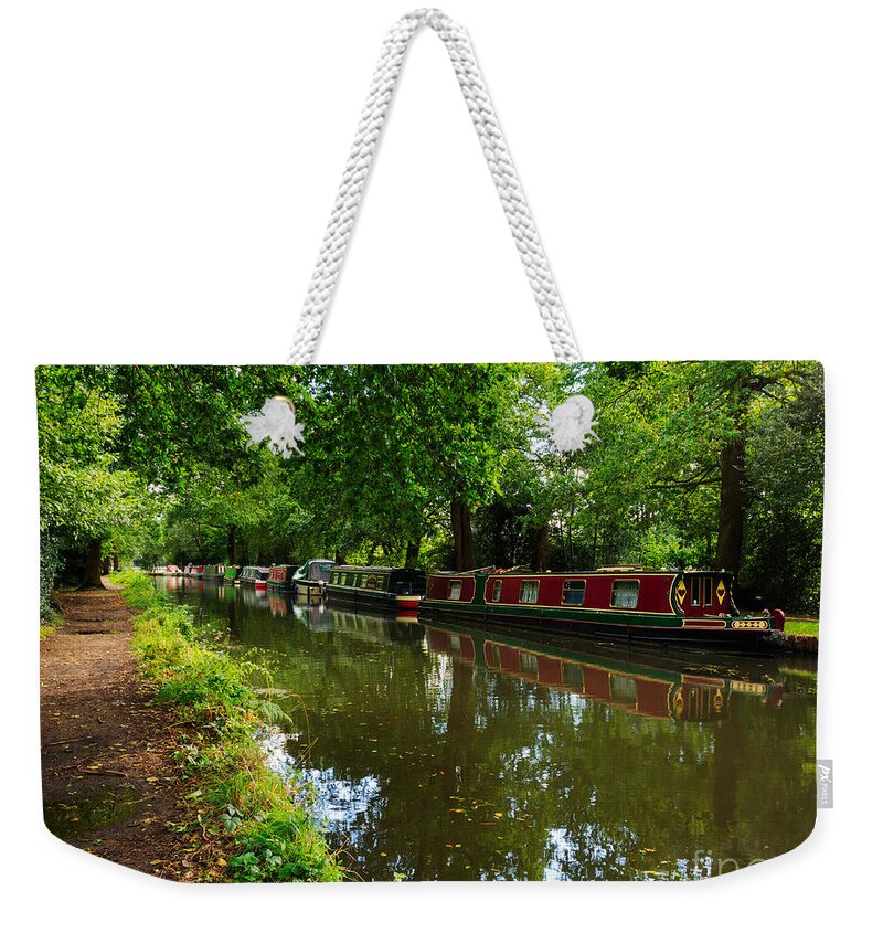 English Canal Weekender Tote Bag featuring the photograph Narrowboats moored on the Wey Navigation in Surrey by Louise Heusinkveld