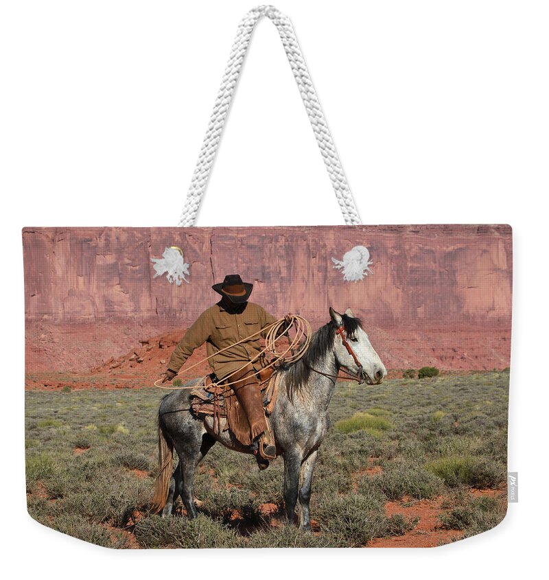 Wild Mustangs Weekender Tote Bag featuring the photograph Navajo Cowboy by Diane Bohna