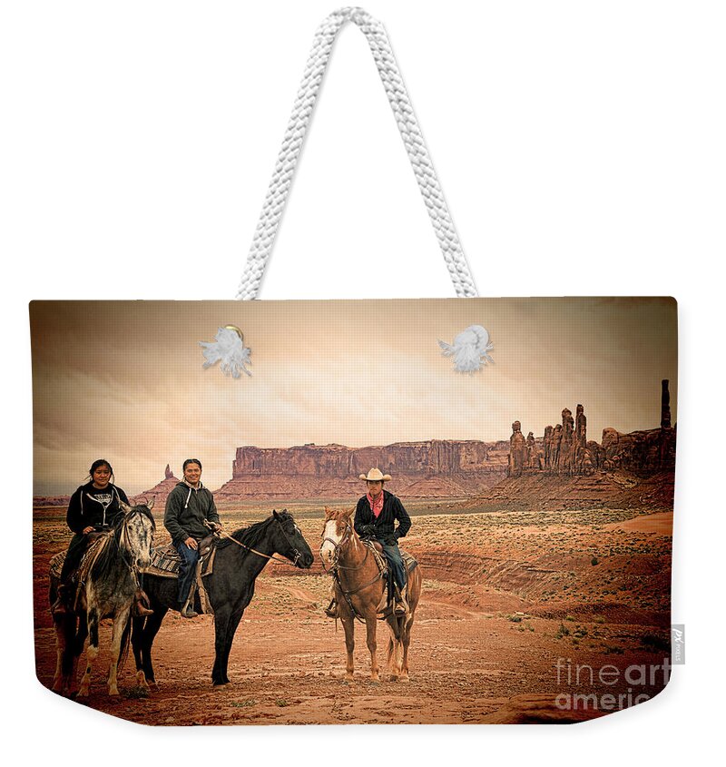 Red Soil Weekender Tote Bag featuring the photograph Navajo Riders by Jim Garrison