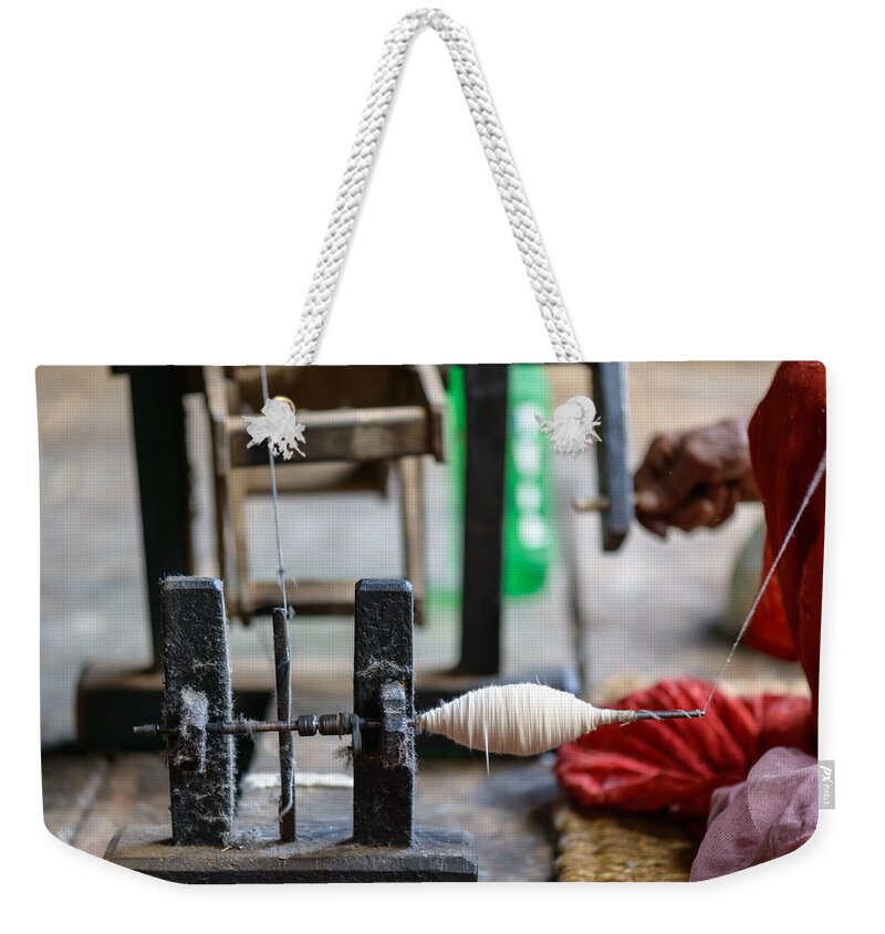 Spinning Weekender Tote Bag featuring the photograph Nepalese woman spinning cotton by Dutourdumonde Photography