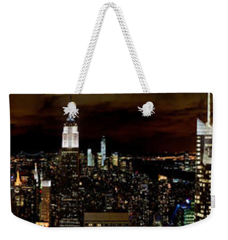 New York Skyline Weekender Tote Bag featuring the photograph New York at night panorama by Gary Eason