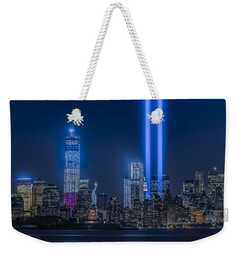 Tribute In Light Weekender Tote Bag featuring the photograph New York City Tribute In Lights by Susan Candelario
