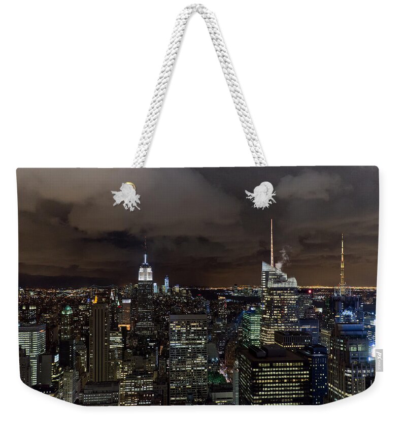 New York Skyline Weekender Tote Bag featuring the photograph New York skyline at night by Gary Eason