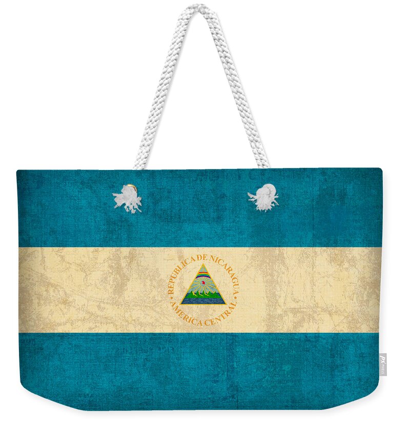 Nicaragua Weekender Tote Bag featuring the mixed media Nicaragua Flag Vintage Distressed Finish by Design Turnpike
