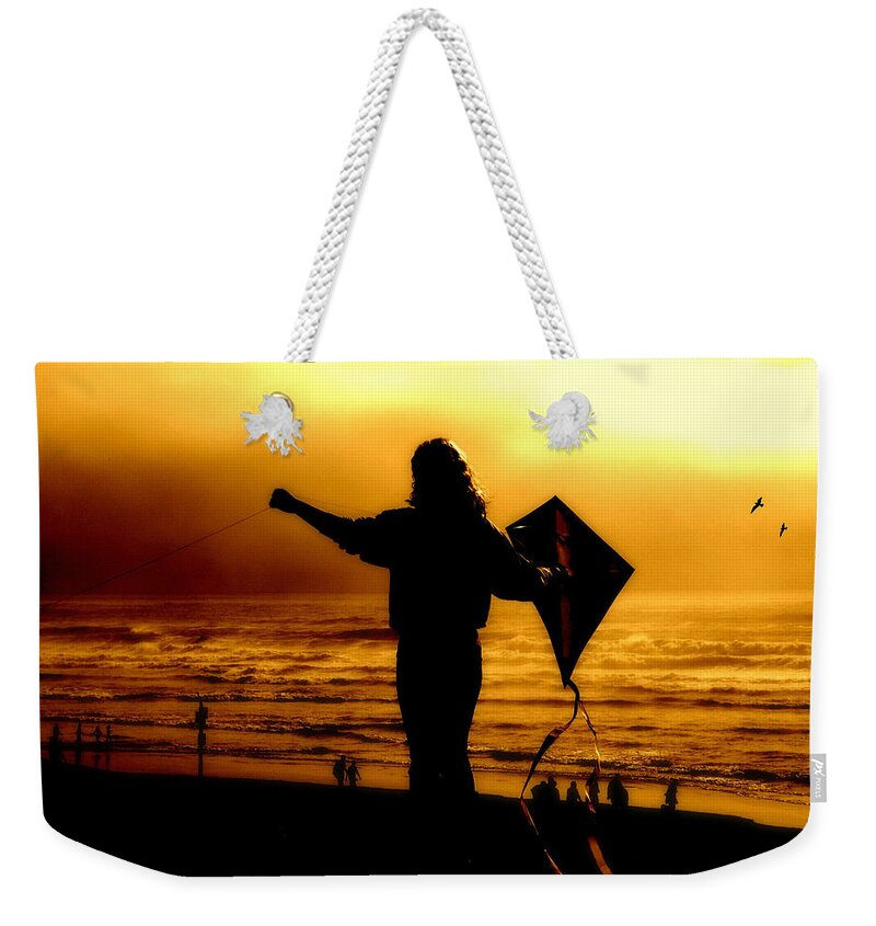Cannon Beach Weekender Tote Bag featuring the photograph Night Flight by Micki Findlay