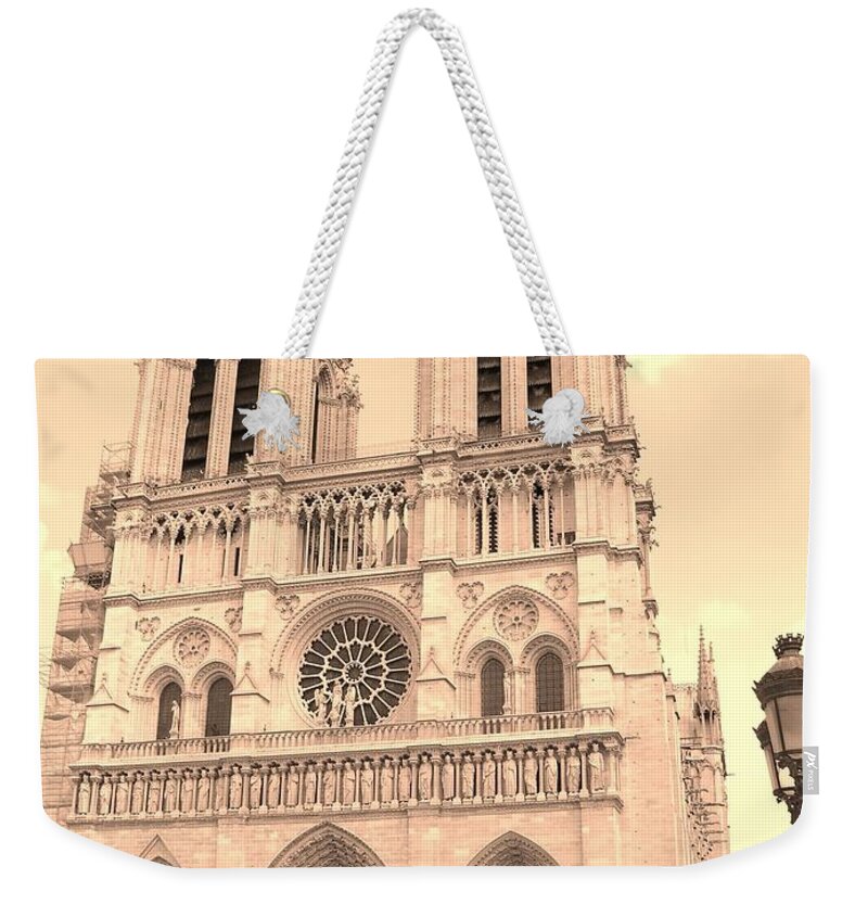 Notre Dame Weekender Tote Bag featuring the photograph Notre Dame Cathedral by Cleaster Cotton