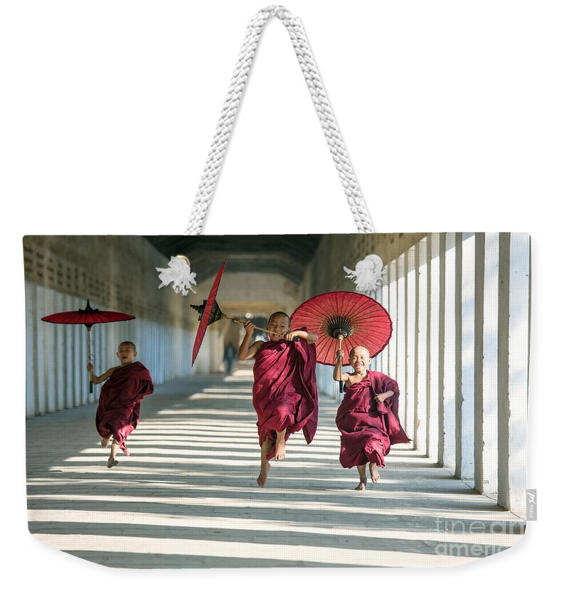 Joy Weekender Tote Bag featuring the photograph Novice monks on the run - Myanmar by Matteo Colombo