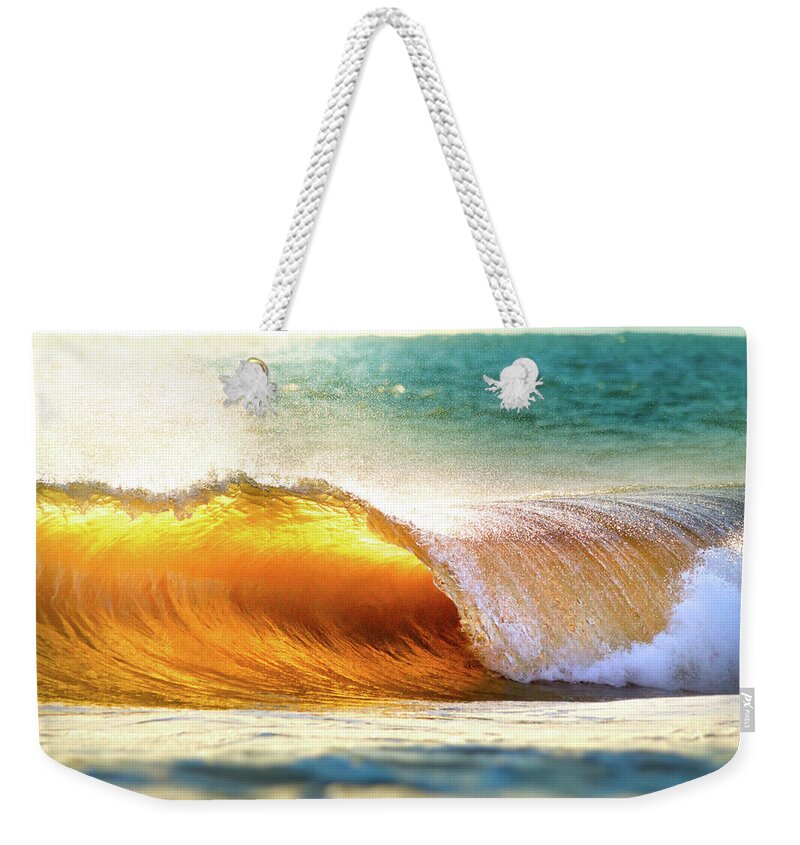 Tranquility Weekender Tote Bag featuring the photograph Ocean Wave Breaking At Sunset by Elojotorpe