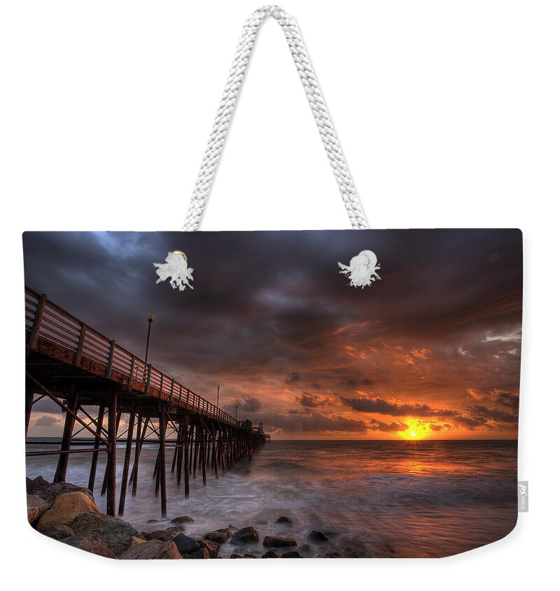 Sunset Weekender Tote Bag featuring the photograph Oceanside Pier Perfect Sunset by Peter Tellone