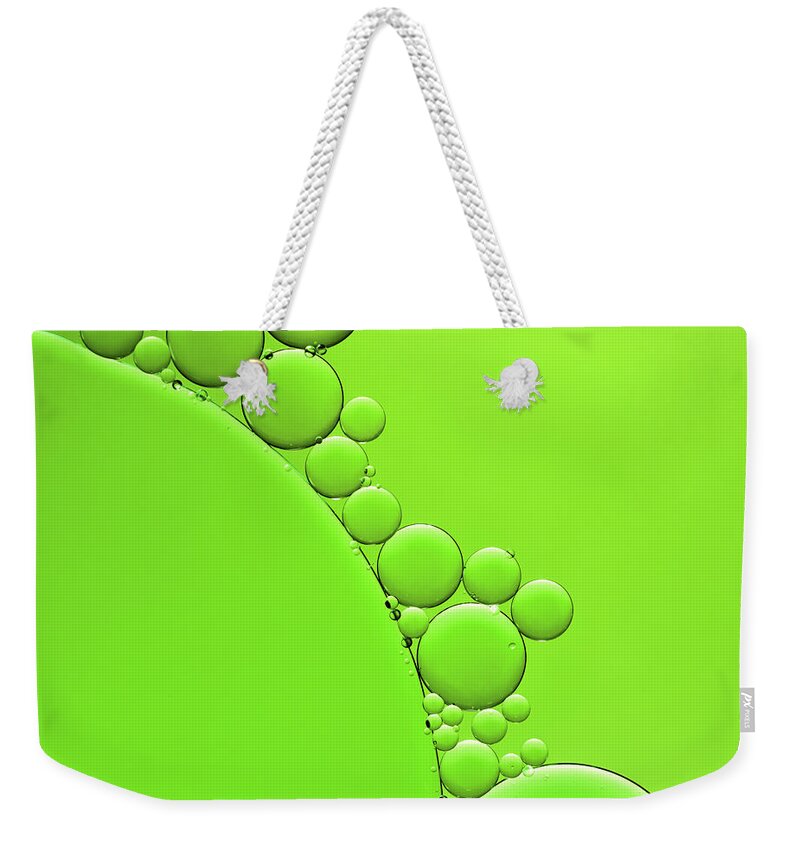 Environmental Conservation Weekender Tote Bag featuring the photograph Oil And Water Abstract Background by Assalve