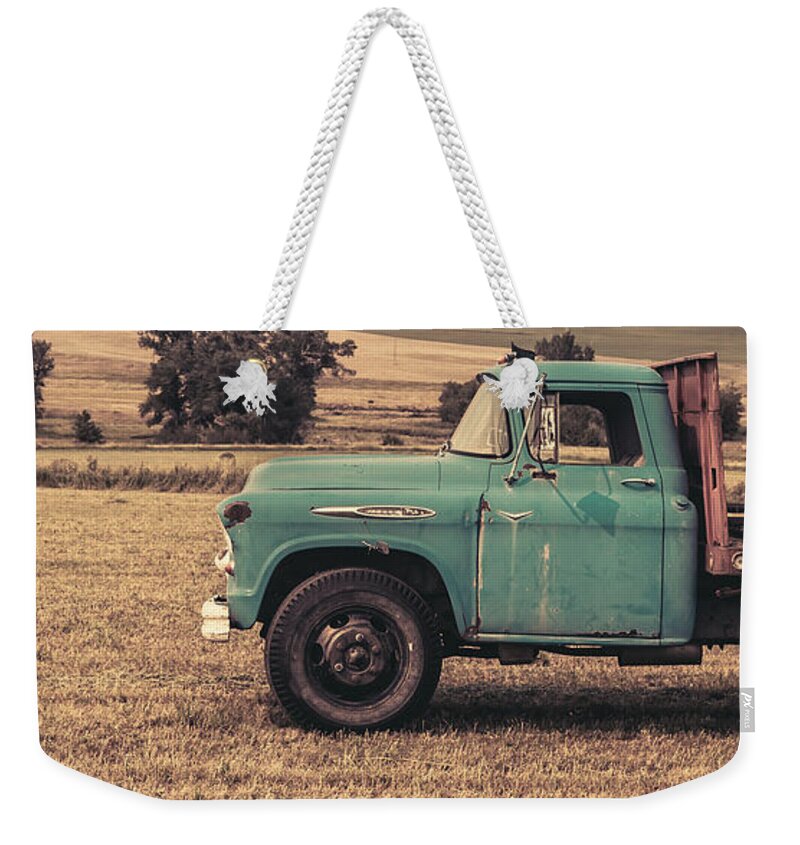 Ranch Weekender Tote Bag featuring the photograph Old Hay truck in the field by Edward Fielding