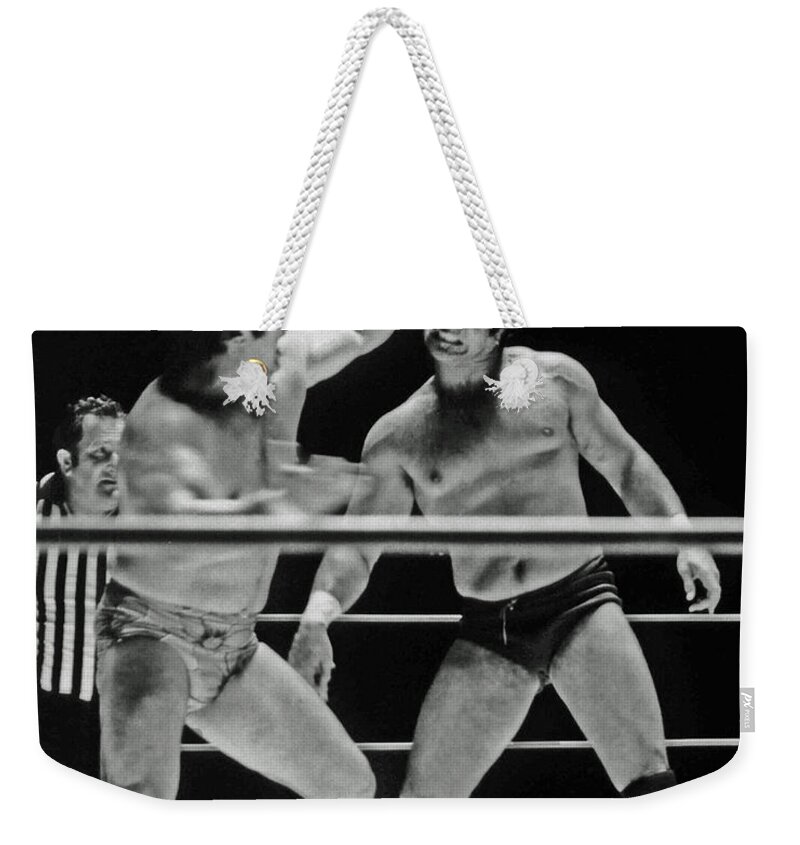 Old School Wrestling Weekender Tote Bag featuring the photograph Old School Wrestlers Dean Ho and Don Muraco Battling it out in the Middle of the Ring by Jim Fitzpatrick