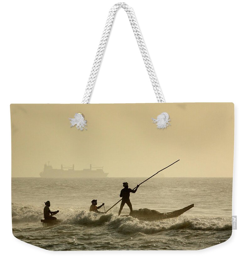 Marina Beach Weekender Tote Bag featuring the photograph On Job At Marina by Muralidharan Alagar Arts And Photography