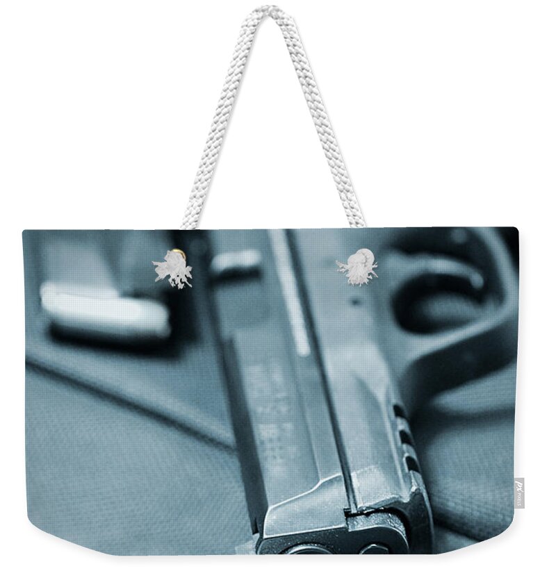 Armed Weekender Tote Bag featuring the photograph On the Lam by Trish Mistric
