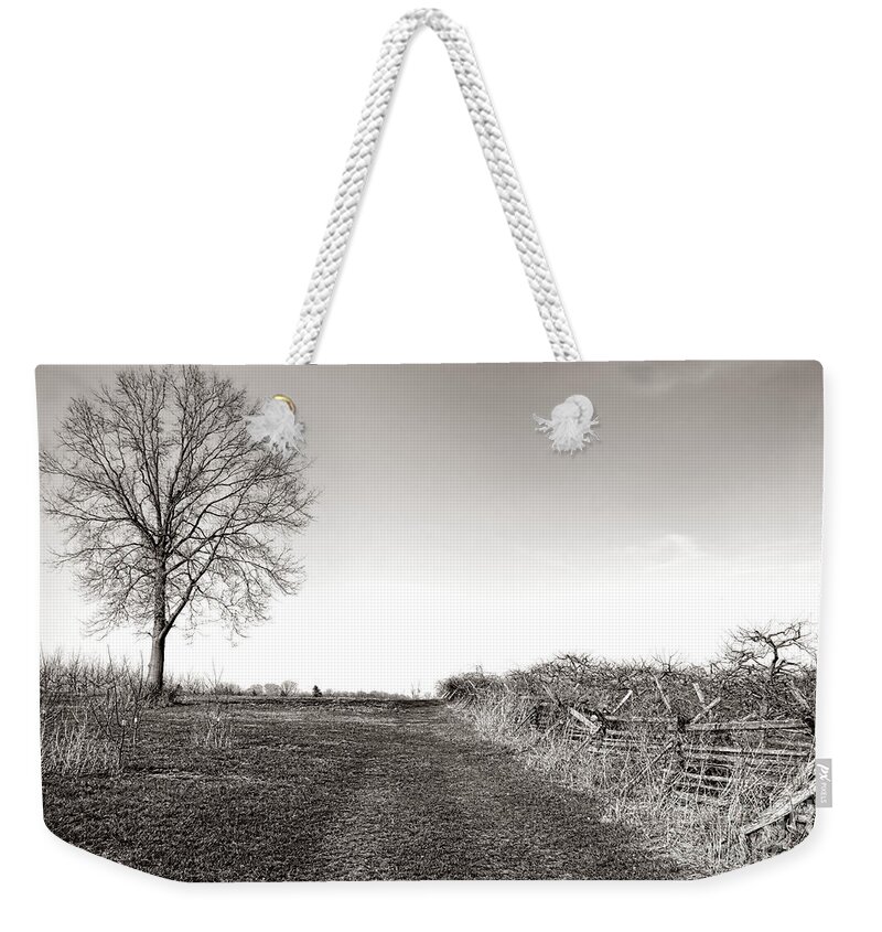 Monmouth Weekender Tote Bag featuring the photograph Once a Battlefield by Olivier Le Queinec