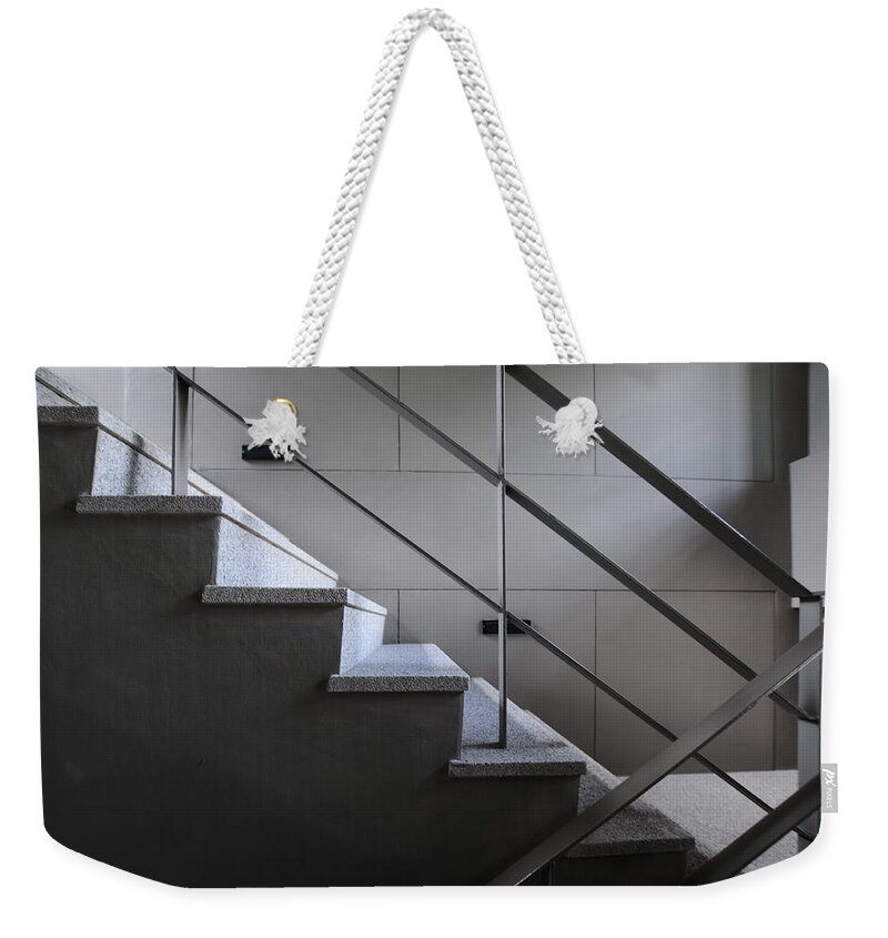 Steps Weekender Tote Bag featuring the photograph Open Stairwell In A Modern Building by Primeimages