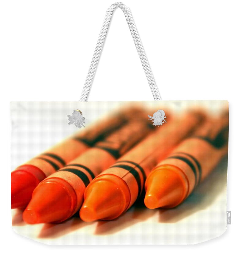 Skompski Weekender Tote Bag featuring the photograph Orange Crayons by Joseph Skompski