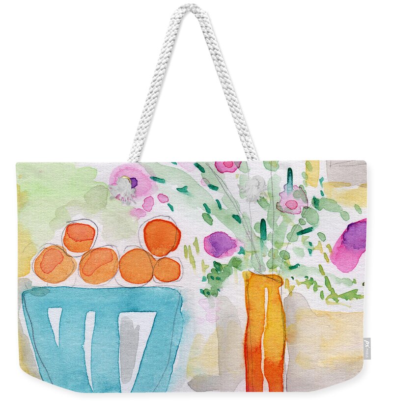 Oranges Weekender Tote Bag featuring the painting Oranges in Blue Bowl- watercolor painting by Linda Woods