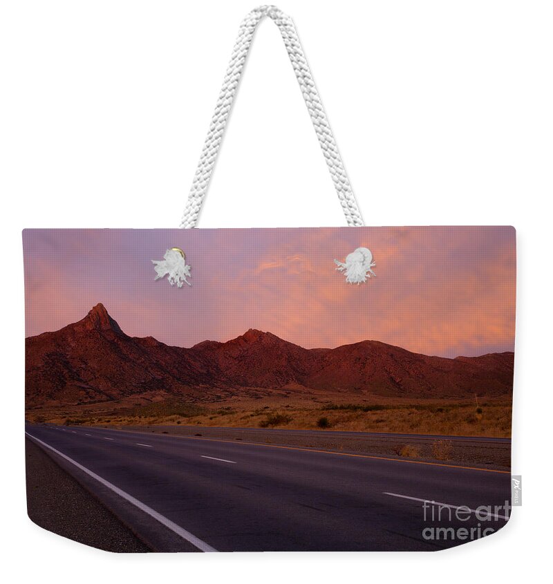 New Mexico Weekender Tote Bag featuring the photograph Organ Mountain Sunrise Highway by Michael Dawson