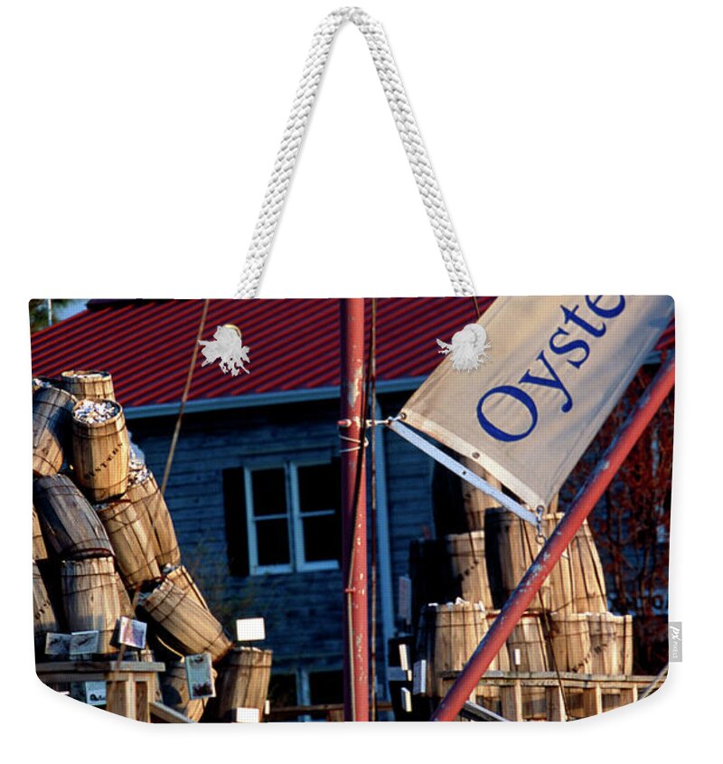 Oystering Weekender Tote Bag featuring the photograph Oystering History at the Maritime Museum in Saint Michaels Maryland by William Kuta