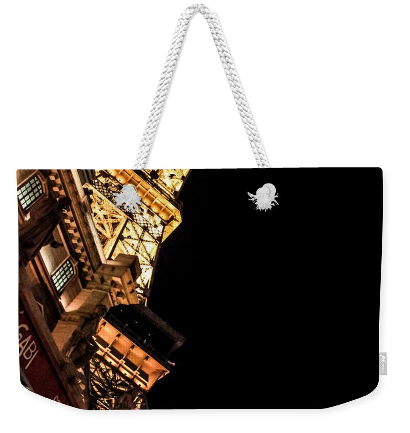 Night Weekender Tote Bag featuring the photograph Paris Las Vegas at night by Eti Reid