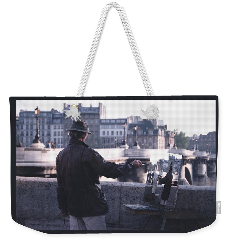 Seine Weekender Tote Bag featuring the photograph Paris Painter Inspiration Magritte by Tom Wurl