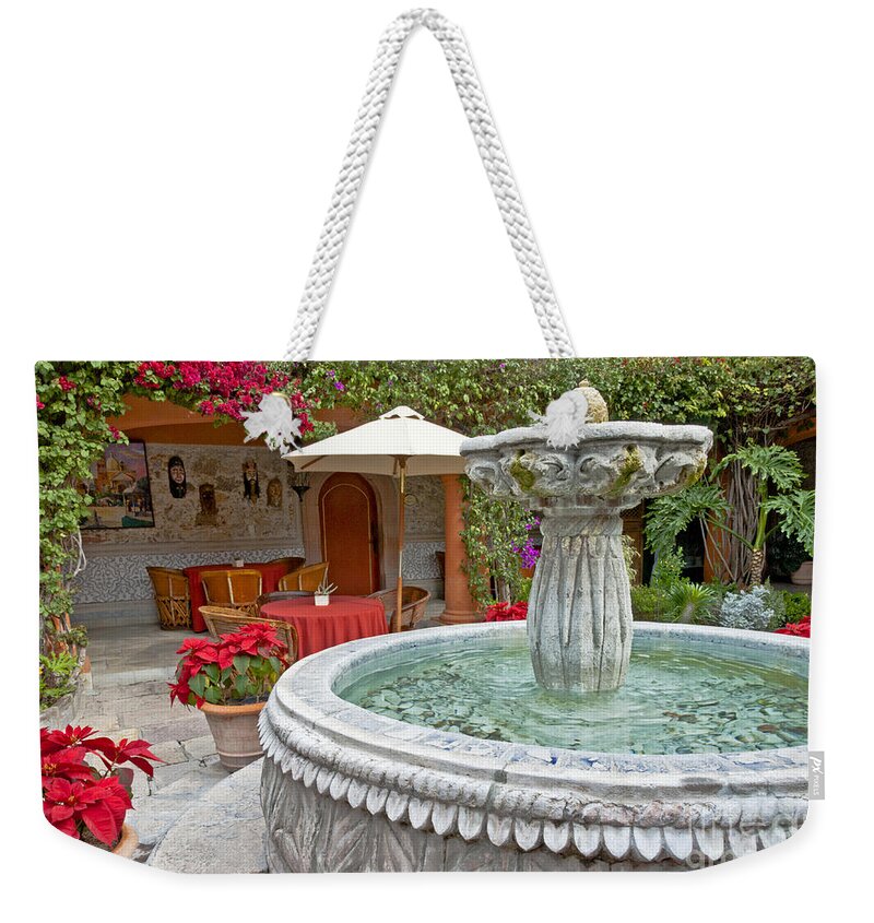 Patio Weekender Tote Bag featuring the photograph Patio And Fountain by Richard & Ellen Thane