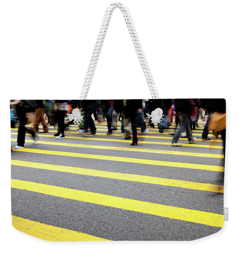 Crowd Weekender Tote Bag featuring the photograph Pedestrians In Hong Kong by Bertlmann