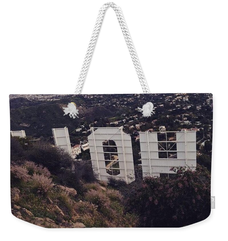 Hollywood Weekender Tote Bag featuring the photograph Peek by Denise Railey