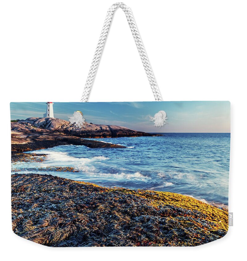 Water's Edge Weekender Tote Bag featuring the photograph Peggys Cove by Shaunl