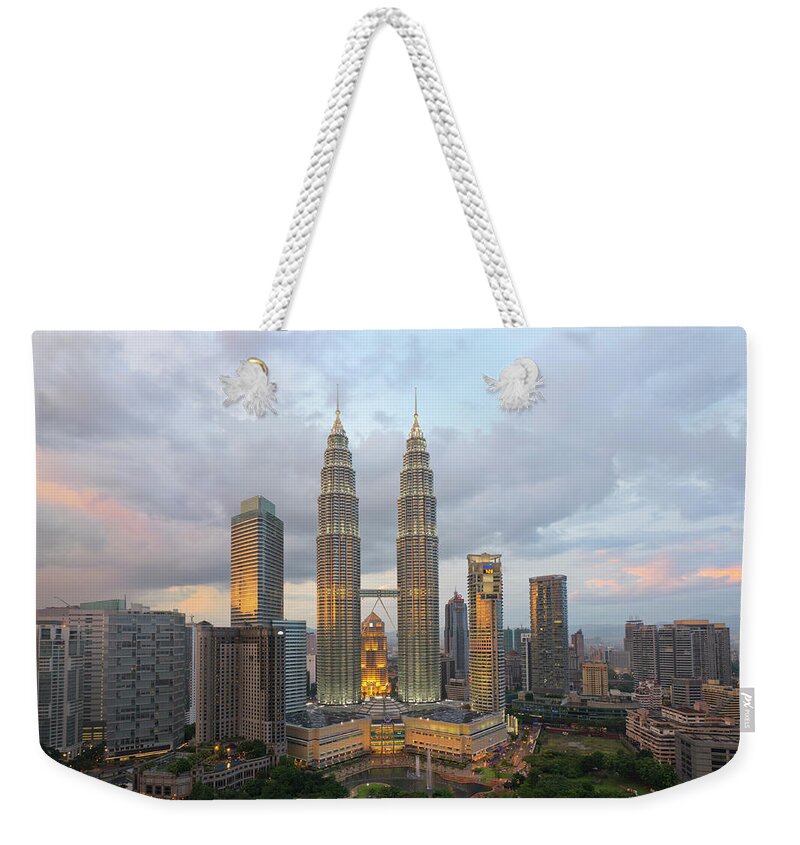 Outdoors Weekender Tote Bag featuring the photograph Petronas Twin Towers, Kuala Lumpur by Travelpix Ltd