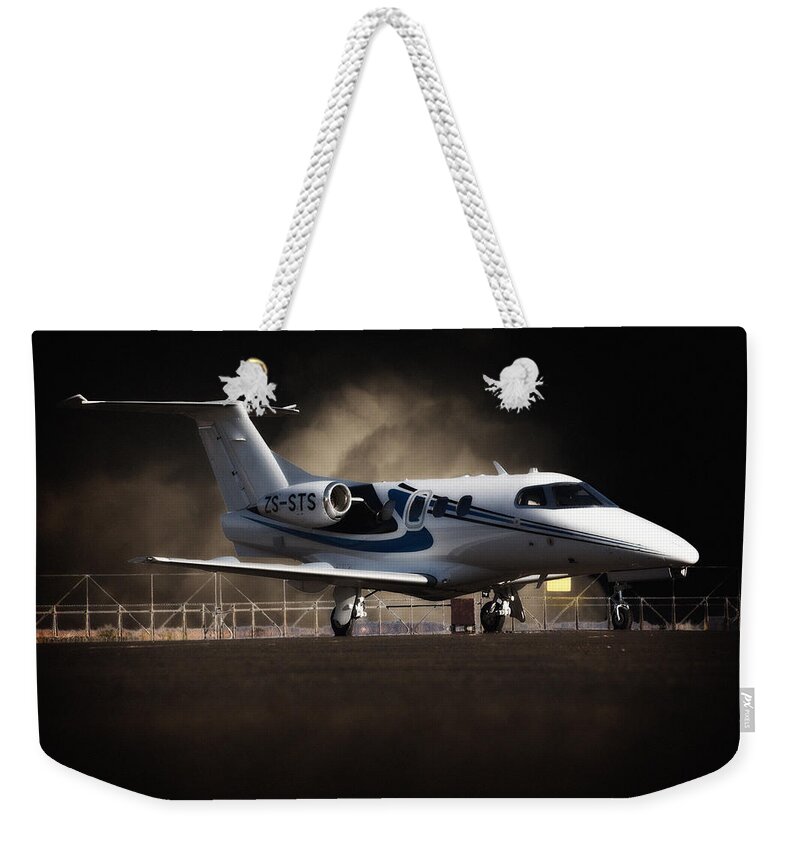 Embraer Weekender Tote Bag featuring the photograph Phenom 100 by Paul Job