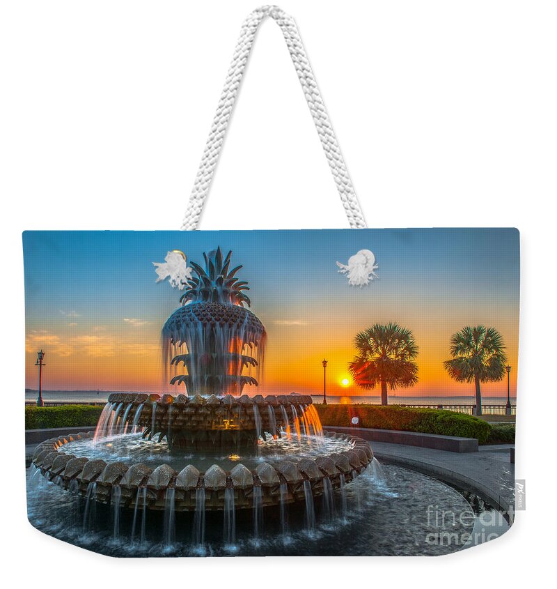 Pineapple Fountain Weekender Tote Bag featuring the photograph Charleston Pineapple Sunrise by Dale Powell