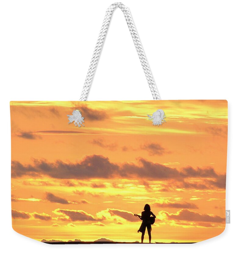 Female Weekender Tote Bag featuring the photograph Playing to the Sun by Dreamland Media