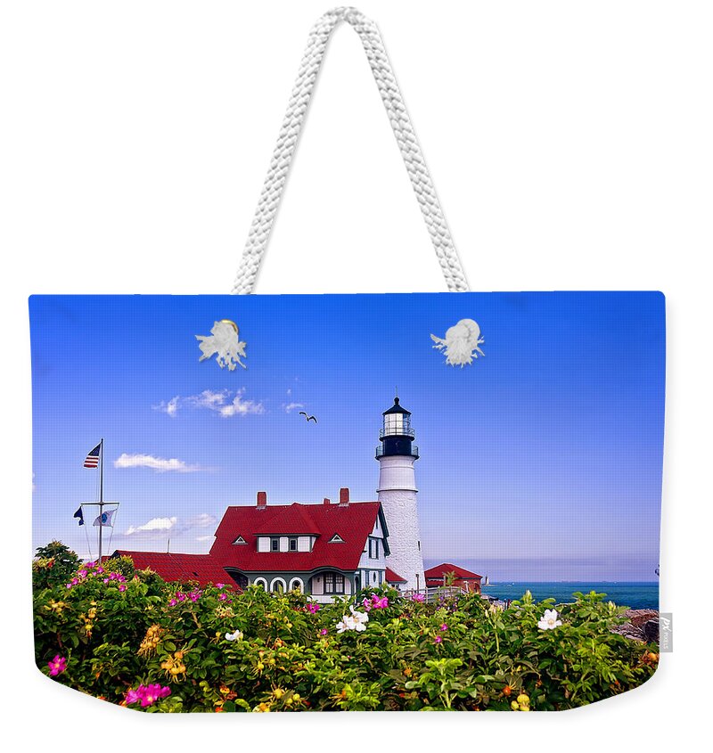 Maine Weekender Tote Bag featuring the photograph Portland Head Light and Roses by Mitchell R Grosky