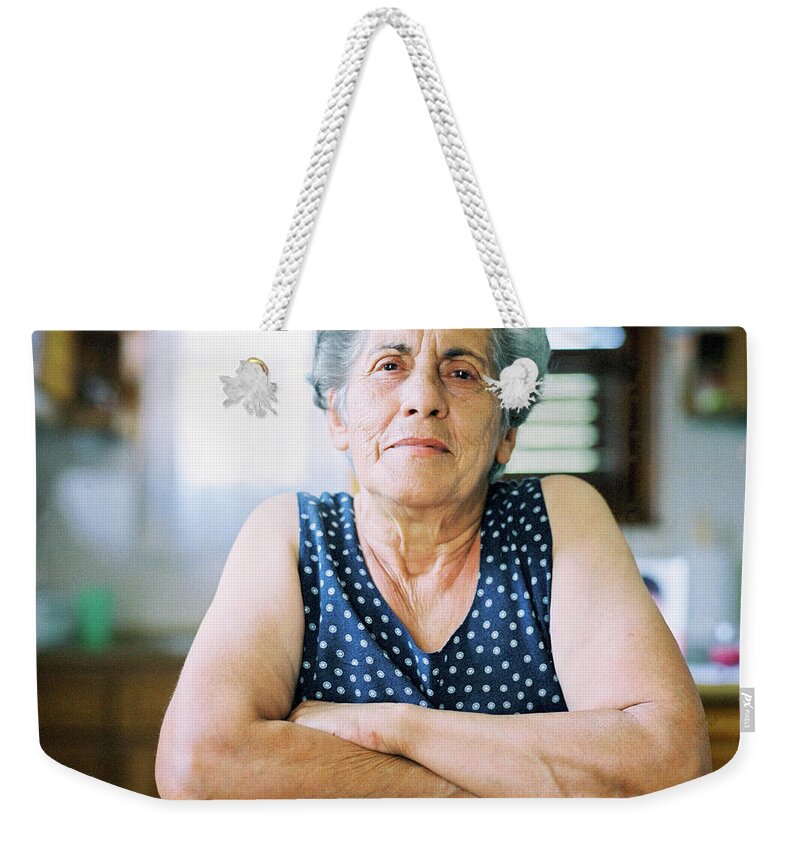 People Weekender Tote Bag featuring the photograph Portrait Of A Senior Woman by Thanasis Zovoilis