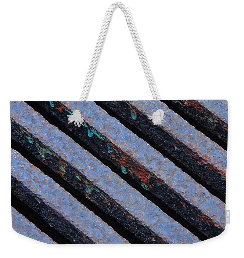 City Scenes Weekender Tote Bag featuring the photograph Protection by Lisa Phillips