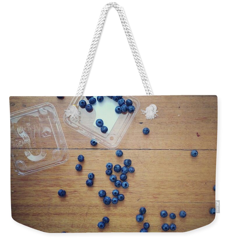Fruit Carton Weekender Tote Bag featuring the photograph Punnet Of Blueberries Spilt On Wooden by Jodie Griggs
