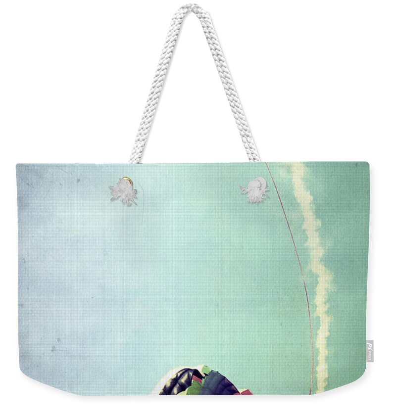 Sky Weekender Tote Bag featuring the photograph Rainbow in Motion by Trish Mistric