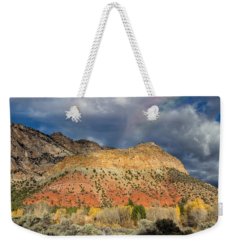 Ashley National Forest Weekender Tote Bag featuring the photograph Rainbow Touching the Mountain by Kathleen Bishop