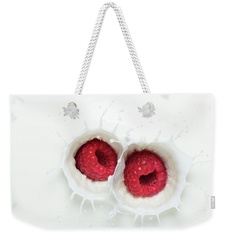 Milk Weekender Tote Bag featuring the photograph Raspberry Milk Splash by Chris Stein