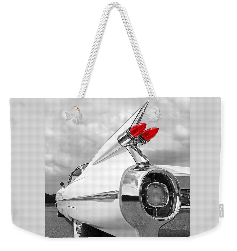 Cadillac Weekender Tote Bag featuring the photograph Reach For The Skies - 1959 Cadillac Tail Fins Black and White by Gill Billington