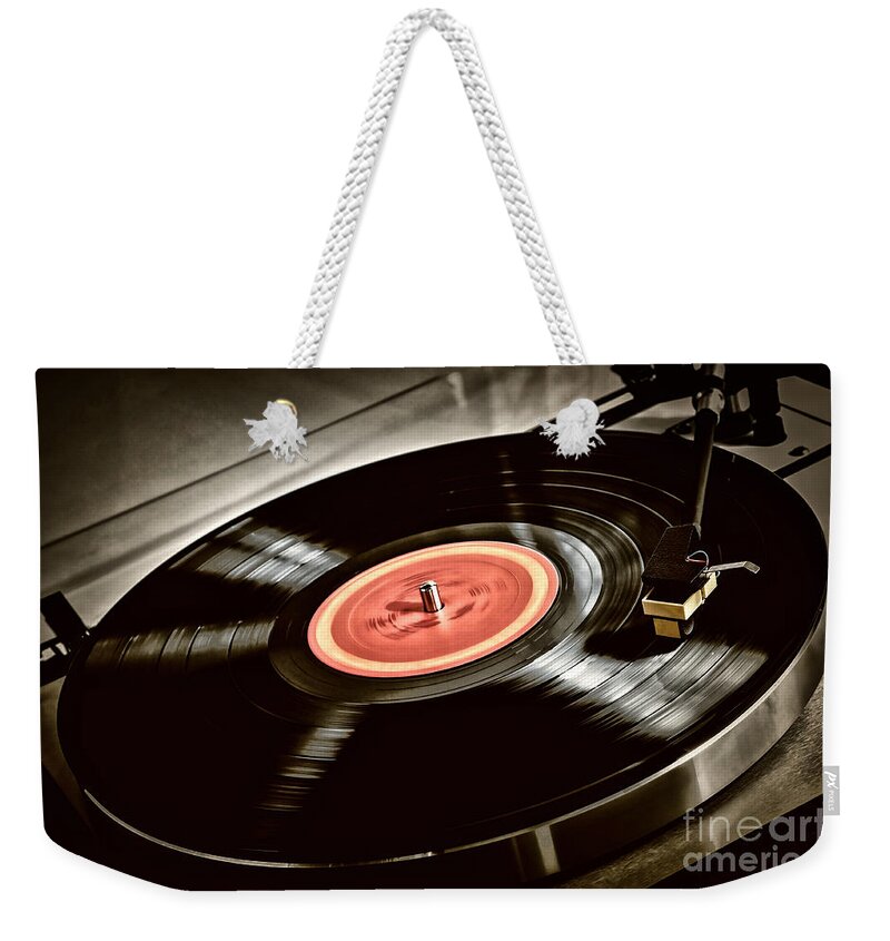 Vinyl Weekender Tote Bag featuring the photograph Record on turntable by Elena Elisseeva