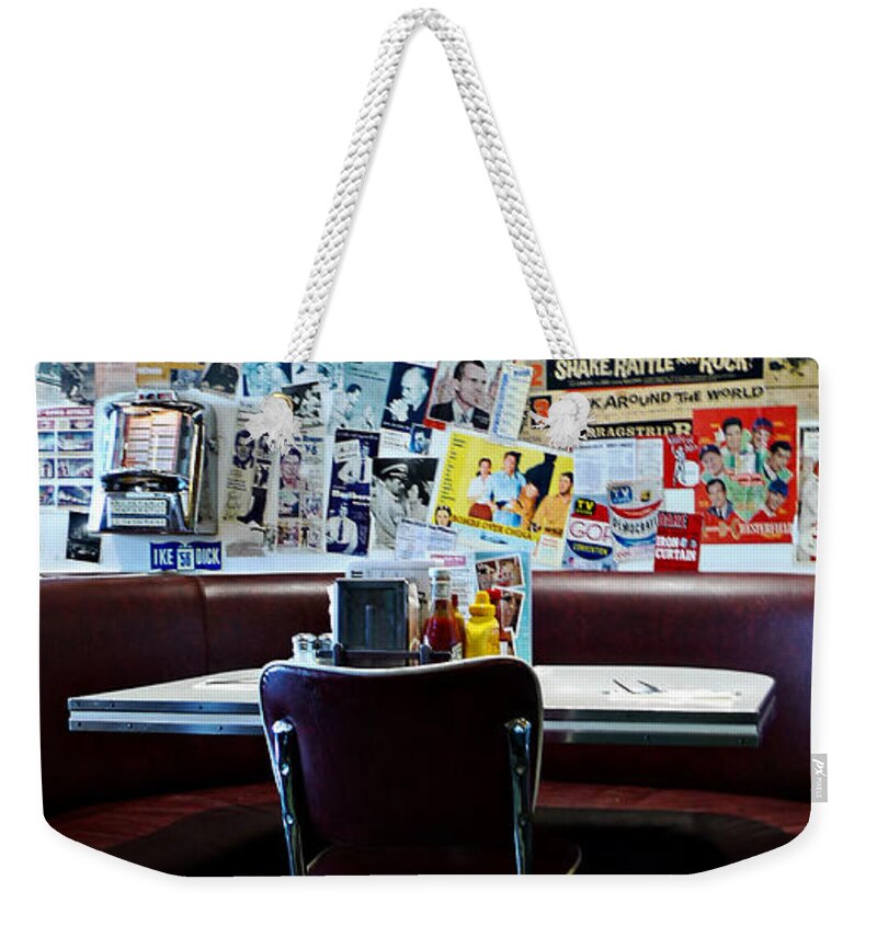 Red Booth Awaits In The Diner Weekender Tote Bag featuring the photograph Red Booth awaits in the Diner by Nina Prommer