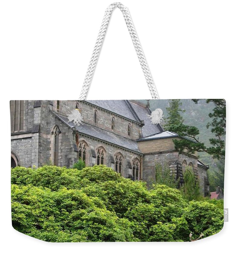 Scottish Highlands Weekender Tote Bag featuring the photograph Red Deer And Church by Denise Railey