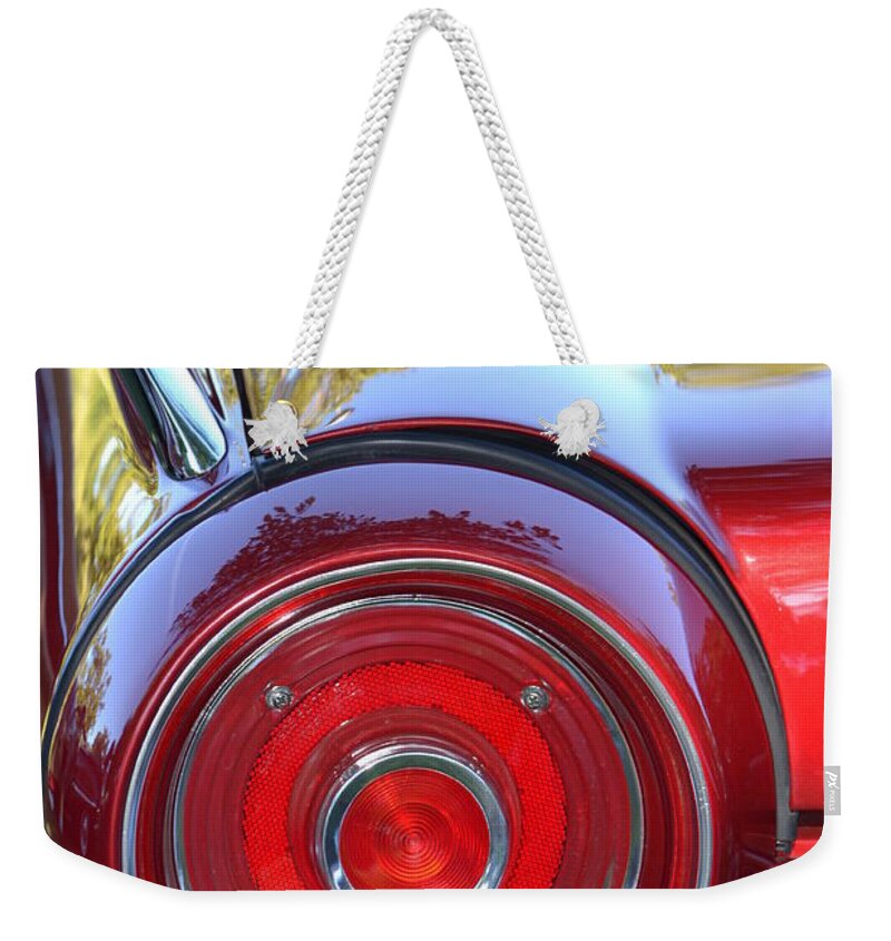Red Weekender Tote Bag featuring the photograph Red Ford Tailight by Dean Ferreira