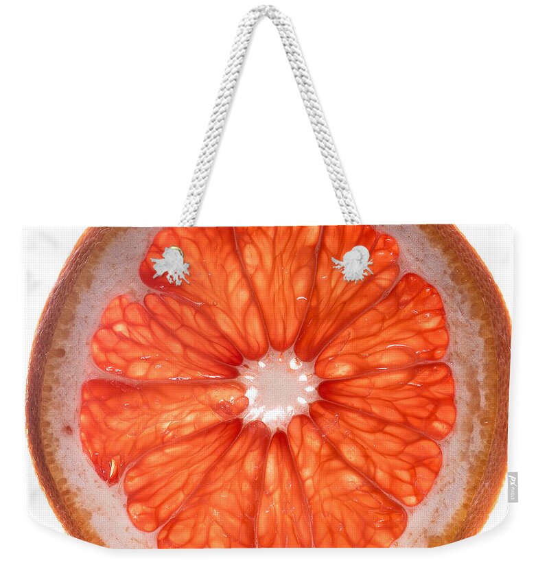 Red Weekender Tote Bag featuring the photograph Red Grapefruit by Steve Gadomski