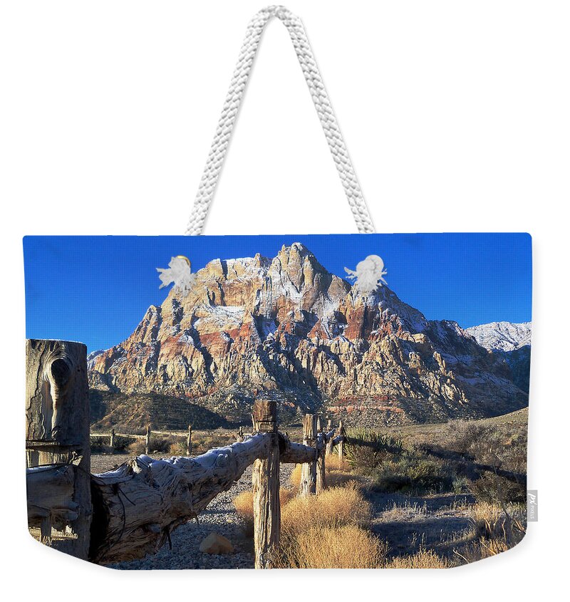 Red Weekender Tote Bag featuring the photograph Red Rock Snow by Alan Socolik